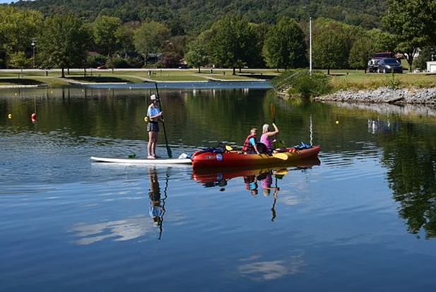 paddle boarder and kayakers